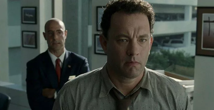 Stanley Tucci (Frank Dixon), Tom Hanks (Viktor Navorski)