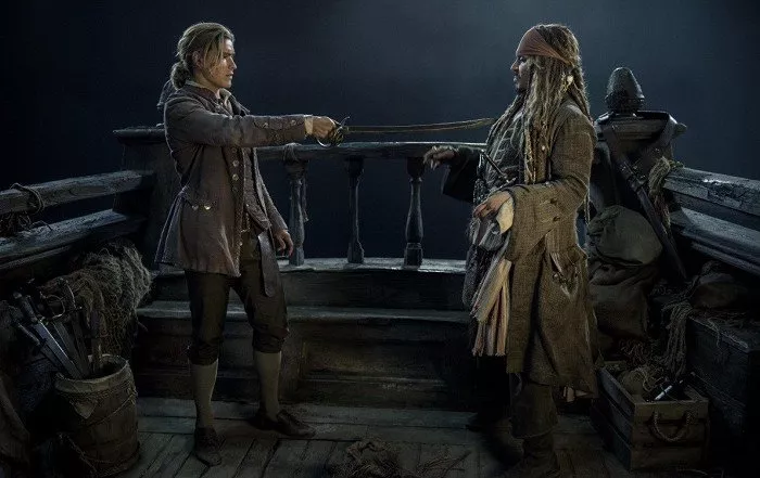 Brenton Thwaites (Henry Turner), Johnny Depp (Captain Jack Sparrow)